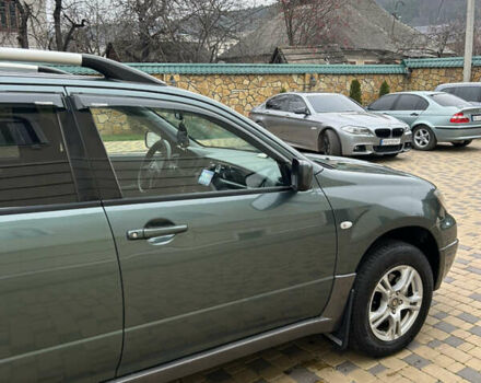 Зеленый Мицубиси Аутлендер, объемом двигателя 2.38 л и пробегом 250 тыс. км за 7200 $, фото 43 на Automoto.ua