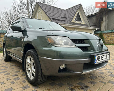 Зеленый Мицубиси Аутлендер, объемом двигателя 2.38 л и пробегом 250 тыс. км за 7200 $, фото 2 на Automoto.ua