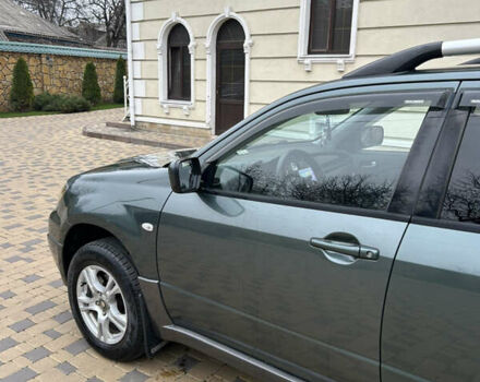 Зеленый Мицубиси Аутлендер, объемом двигателя 2.38 л и пробегом 250 тыс. км за 7200 $, фото 45 на Automoto.ua