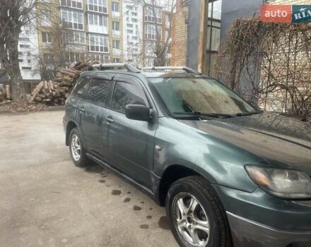 Зелений Міцубісі Аутлендер, об'ємом двигуна 2.4 л та пробігом 300 тис. км за 5000 $, фото 3 на Automoto.ua