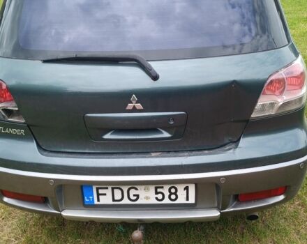 Зеленый Мицубиси Аутлендер, объемом двигателя 3 л и пробегом 220 тыс. км за 4000 $, фото 1 на Automoto.ua