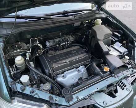 Зелений Міцубісі Аутлендер, об'ємом двигуна 2 л та пробігом 225 тис. км за 7000 $, фото 32 на Automoto.ua