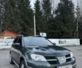 Зелений Міцубісі Аутлендер, об'ємом двигуна 2 л та пробігом 286 тис. км за 6000 $, фото 1 на Automoto.ua