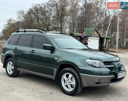 Зеленый Мицубиси Аутлендер, объемом двигателя 2 л и пробегом 194 тыс. км за 6350 $, фото 2 на Automoto.ua