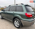 Зеленый Мицубиси Аутлендер, объемом двигателя 2 л и пробегом 194 тыс. км за 6350 $, фото 16 на Automoto.ua