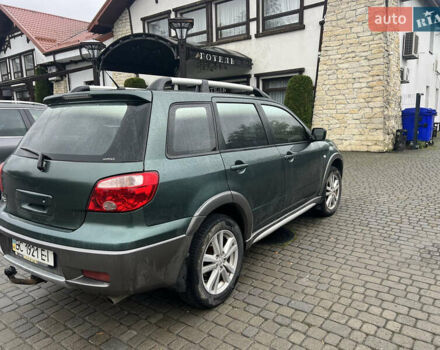 Зеленый Мицубиси Аутлендер, объемом двигателя 2.38 л и пробегом 213 тыс. км за 5999 $, фото 2 на Automoto.ua