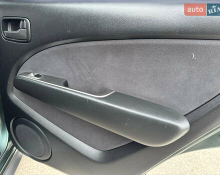 Зеленый Мицубиси Аутлендер, объемом двигателя 2 л и пробегом 194 тыс. км за 6350 $, фото 28 на Automoto.ua