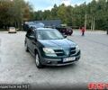 Зеленый Мицубиси Аутлендер, объемом двигателя 2.4 л и пробегом 231 тыс. км за 8000 $, фото 1 на Automoto.ua