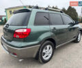 Зеленый Мицубиси Аутлендер, объемом двигателя 2 л и пробегом 194 тыс. км за 6350 $, фото 17 на Automoto.ua