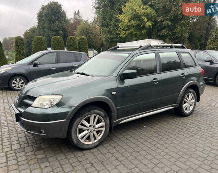 Зеленый Мицубиси Аутлендер, объемом двигателя 2.38 л и пробегом 213 тыс. км за 5999 $, фото 1 на Automoto.ua