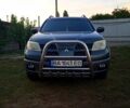 Зелений Міцубісі Аутлендер, об'ємом двигуна 2.4 л та пробігом 220 тис. км за 7250 $, фото 1 на Automoto.ua