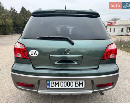 Зеленый Мицубиси Аутлендер, объемом двигателя 2 л и пробегом 194 тыс. км за 6350 $, фото 15 на Automoto.ua