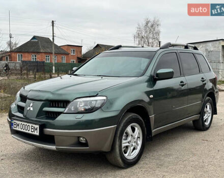 Зеленый Мицубиси Аутлендер, объемом двигателя 2 л и пробегом 194 тыс. км за 6350 $, фото 3 на Automoto.ua