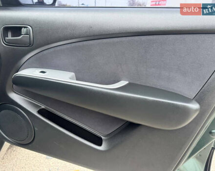 Зеленый Мицубиси Аутлендер, объемом двигателя 2 л и пробегом 194 тыс. км за 6350 $, фото 33 на Automoto.ua