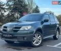 Зеленый Мицубиси Аутлендер, объемом двигателя 2.38 л и пробегом 212 тыс. км за 6899 $, фото 1 на Automoto.ua
