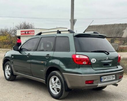 Зелений Міцубісі Аутлендер, об'ємом двигуна 2 л та пробігом 194 тис. км за 6350 $, фото 4 на Automoto.ua