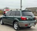 Зелений Міцубісі Аутлендер, об'ємом двигуна 2 л та пробігом 194 тис. км за 6350 $, фото 4 на Automoto.ua