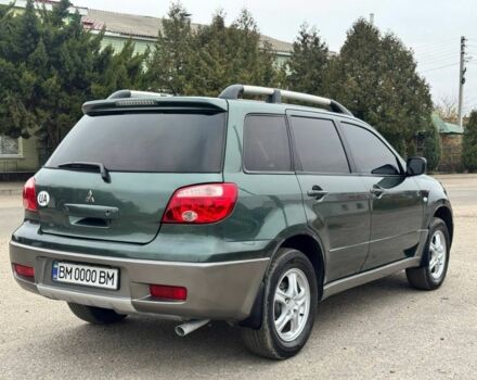 Зелений Міцубісі Аутлендер, об'ємом двигуна 2 л та пробігом 194 тис. км за 6350 $, фото 6 на Automoto.ua