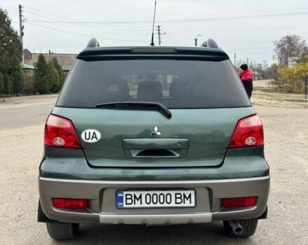 Зелений Міцубісі Аутлендер, об'ємом двигуна 2 л та пробігом 194 тис. км за 6350 $, фото 5 на Automoto.ua