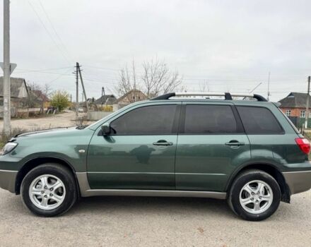 Зелений Міцубісі Аутлендер, об'ємом двигуна 2 л та пробігом 194 тис. км за 6350 $, фото 3 на Automoto.ua