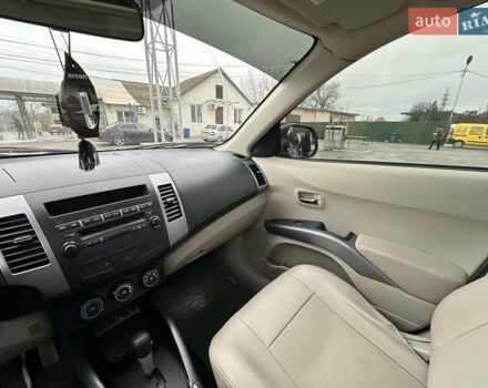 Зелений Міцубісі Аутлендер, об'ємом двигуна 2.36 л та пробігом 80 тис. км за 10500 $, фото 15 на Automoto.ua