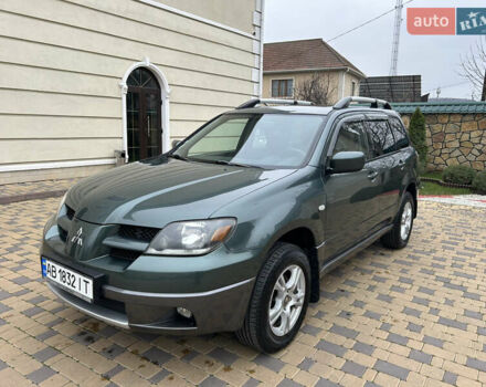 Зеленый Мицубиси Аутлендер, объемом двигателя 2.38 л и пробегом 250 тыс. км за 7200 $, фото 1 на Automoto.ua