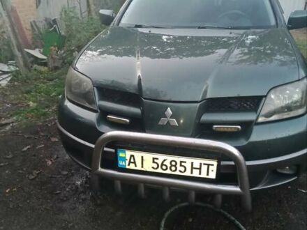 Зелений Міцубісі Аутлендер, об'ємом двигуна 2.4 л та пробігом 325 тис. км за 4500 $, фото 1 на Automoto.ua