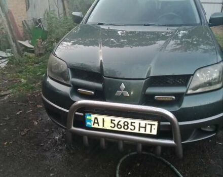 Зелений Міцубісі Аутлендер, об'ємом двигуна 2.4 л та пробігом 325 тис. км за 4500 $, фото 1 на Automoto.ua