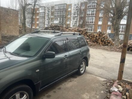 Зеленый Мицубиси Аутлендер, объемом двигателя 2.4 л и пробегом 3 тыс. км за 5000 $, фото 1 на Automoto.ua