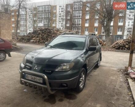 Зелений Міцубісі Аутлендер, об'ємом двигуна 2.4 л та пробігом 300 тис. км за 5000 $, фото 1 на Automoto.ua