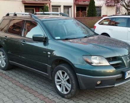 Зеленый Мицубиси Аутлендер, объемом двигателя 2.4 л и пробегом 226 тыс. км за 3500 $, фото 1 на Automoto.ua