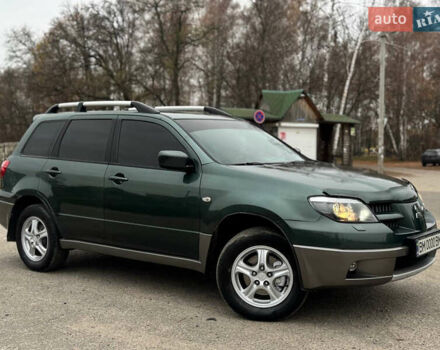 Зеленый Мицубиси Аутлендер, объемом двигателя 2 л и пробегом 194 тыс. км за 6350 $, фото 1 на Automoto.ua