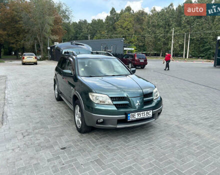 Зеленый Мицубиси Аутлендер, объемом двигателя 2.38 л и пробегом 231 тыс. км за 8000 $, фото 1 на Automoto.ua