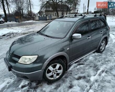 Зелений Міцубісі Аутлендер, об'ємом двигуна 2.4 л та пробігом 280 тис. км за 5600 $, фото 1 на Automoto.ua