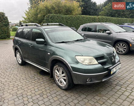 Зеленый Мицубиси Аутлендер, объемом двигателя 2.38 л и пробегом 213 тыс. км за 5999 $, фото 1 на Automoto.ua