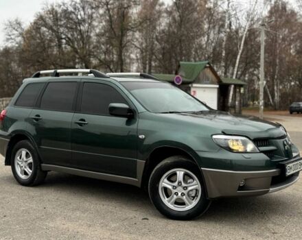 Зеленый Мицубиси Аутлендер, объемом двигателя 2 л и пробегом 194 тыс. км за 6350 $, фото 1 на Automoto.ua