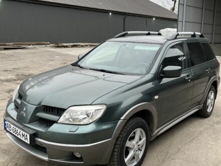 Зелений Міцубісі Аутлендер, об'ємом двигуна 2.4 л та пробігом 119 тис. км за 4800 $, фото 1 на Automoto.ua