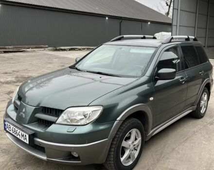 Зелений Міцубісі Аутлендер, об'ємом двигуна 2.4 л та пробігом 119 тис. км за 4800 $, фото 1 на Automoto.ua