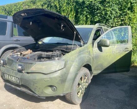 Зеленый Мицубиси Аутлендер, объемом двигателя 2 л и пробегом 400 тыс. км за 4270 $, фото 1 на Automoto.ua