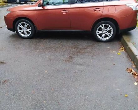 Помаранчевий Міцубісі Аутлендер, об'ємом двигуна 2.4 л та пробігом 166 тис. км за 11700 $, фото 6 на Automoto.ua