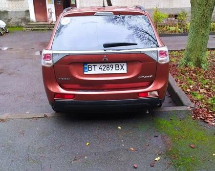 Помаранчевий Міцубісі Аутлендер, об'ємом двигуна 2.4 л та пробігом 166 тис. км за 11700 $, фото 1 на Automoto.ua