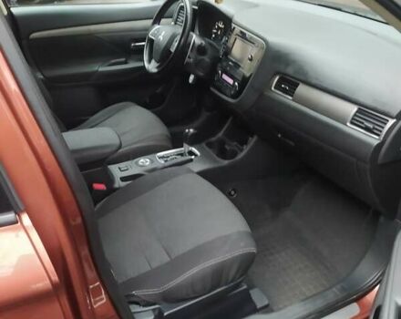 Помаранчевий Міцубісі Аутлендер, об'ємом двигуна 2.4 л та пробігом 166 тис. км за 11700 $, фото 4 на Automoto.ua