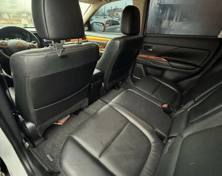 Оранжевый Мицубиси Аутлендер, объемом двигателя 2.36 л и пробегом 155 тыс. км за 12999 $, фото 1 на Automoto.ua