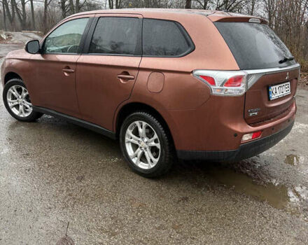 Оранжевый Мицубиси Аутлендер, объемом двигателя 2.36 л и пробегом 201 тыс. км за 10900 $, фото 2 на Automoto.ua