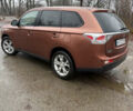Оранжевый Мицубиси Аутлендер, объемом двигателя 2.36 л и пробегом 201 тыс. км за 10900 $, фото 2 на Automoto.ua