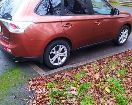 Помаранчевий Міцубісі Аутлендер, об'ємом двигуна 2.4 л та пробігом 166 тис. км за 11700 $, фото 5 на Automoto.ua