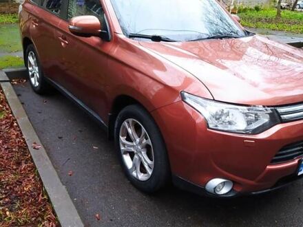 Оранжевый Мицубиси Аутлендер, объемом двигателя 2.4 л и пробегом 166 тыс. км за 11700 $, фото 1 на Automoto.ua