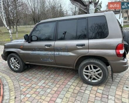 Бежевий Міцубісі Паджеро Пінін, об'ємом двигуна 1.83 л та пробігом 264 тис. км за 5750 $, фото 1 на Automoto.ua
