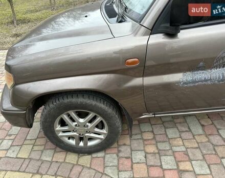 Бежевий Міцубісі Паджеро Пінін, об'ємом двигуна 1.83 л та пробігом 264 тис. км за 5750 $, фото 12 на Automoto.ua