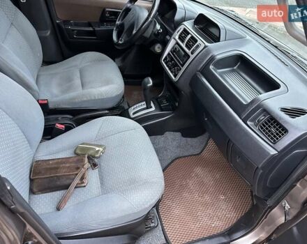 Бежевий Міцубісі Паджеро Пінін, об'ємом двигуна 1.83 л та пробігом 264 тис. км за 5750 $, фото 19 на Automoto.ua
